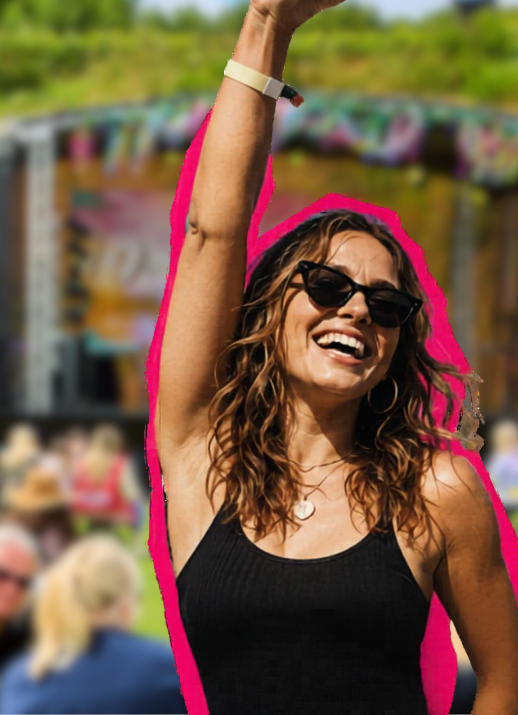 Melissa at a festival, hand in the air
